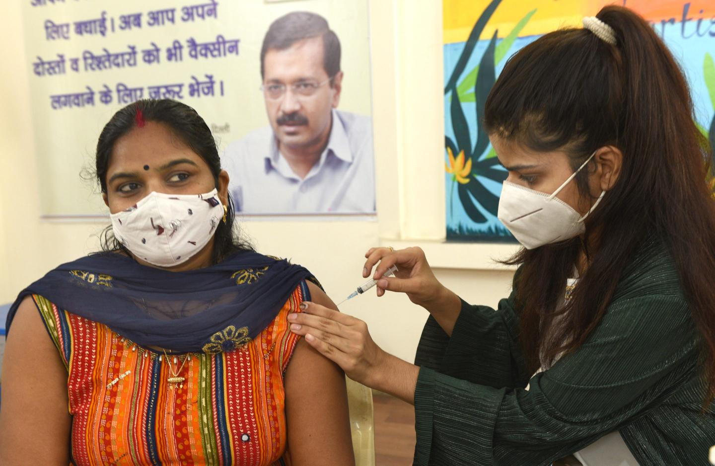 Health worker receiving Covid-19 vaccine