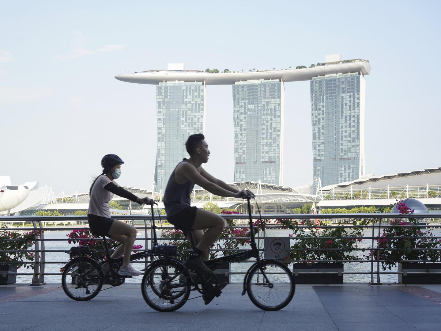 Highly-vaccinated, but more cases than ever: Singapore shows the world what ‘endemic’ COVID might look like