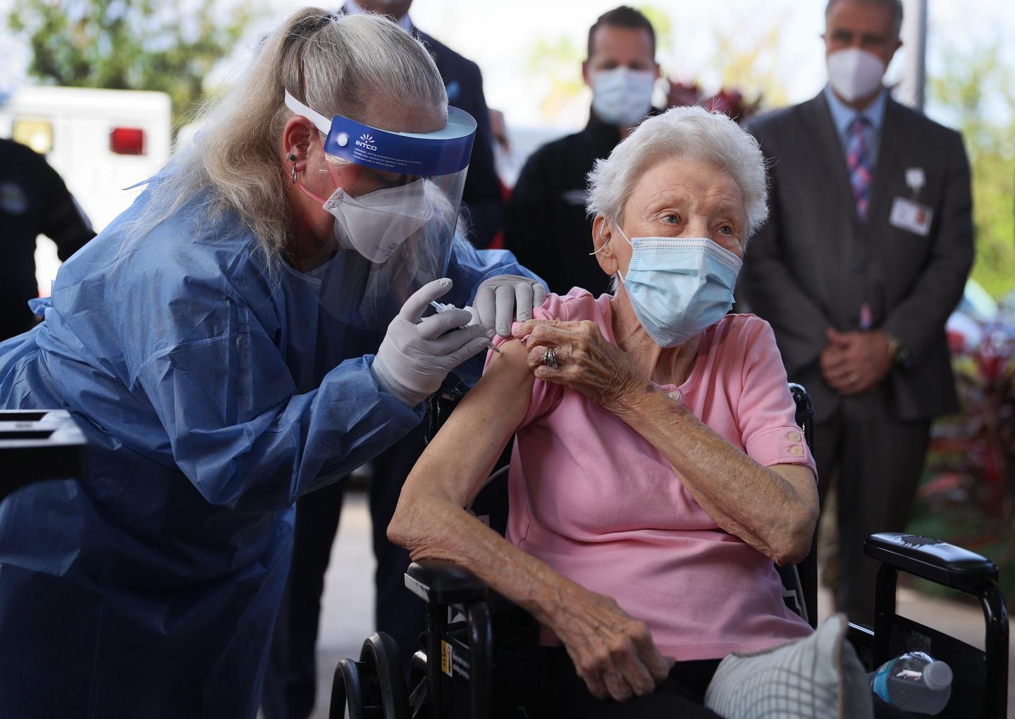 Elderly woman getting COVID-19 vaccine