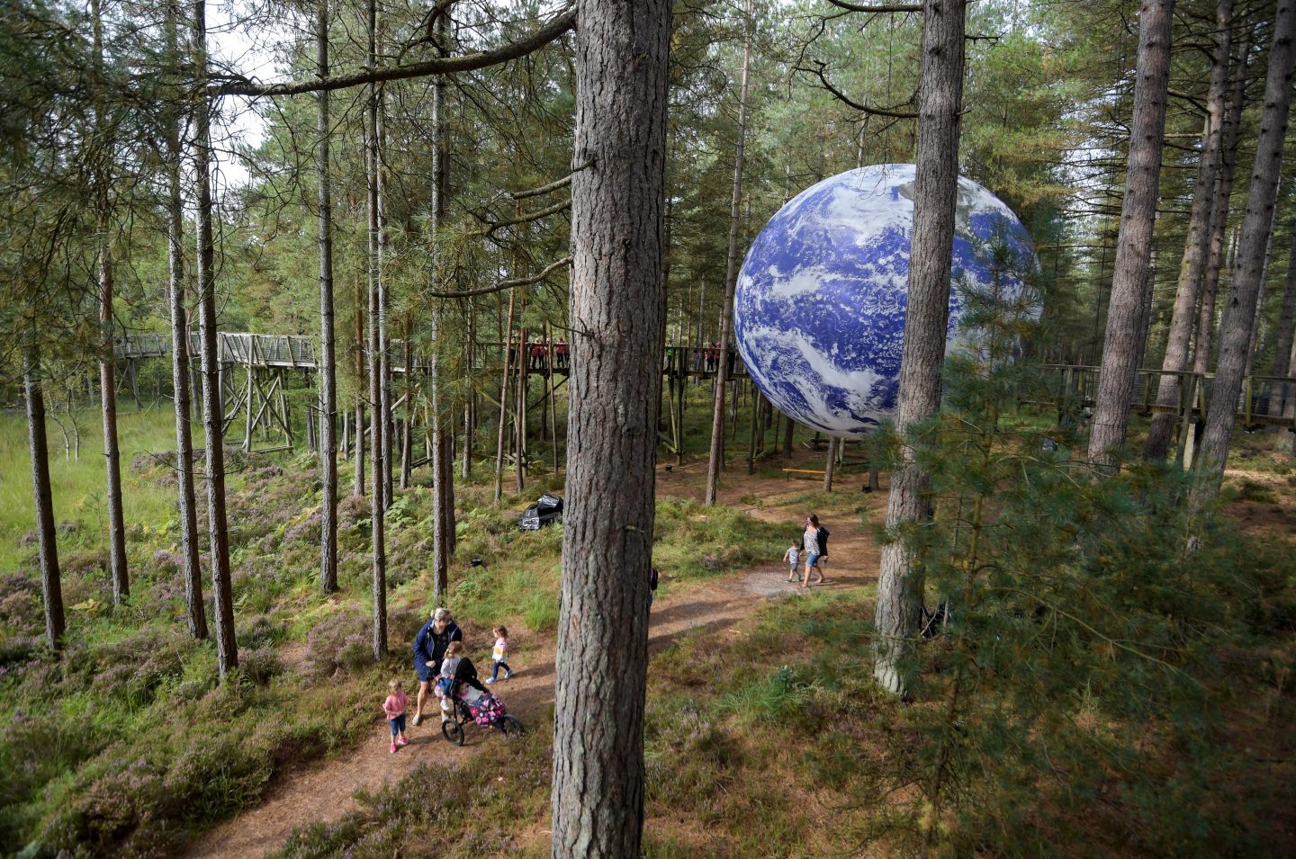 Luke Jerram's installation 'Gaia', a seven-meter replica of planet Earth, at Moors Valley Country Park and Forest, UK.