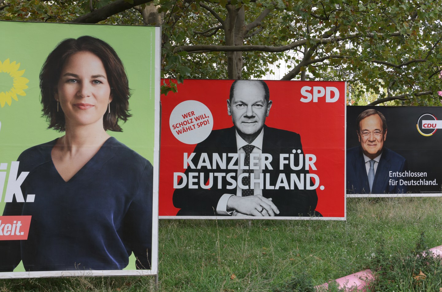 Election campaign billboards showing Annalena Baerbock, chancellor candidate of the German Greens Party, Olaf Scholz, chancellor candidate of the German Social Democrats (SPD), and Armin Laschet, chancellor candidate of the Christian Democrats (CDU/CSU), stand ahead of federal parliamentary elections on September 21, 2021 in Berlin, Germany.