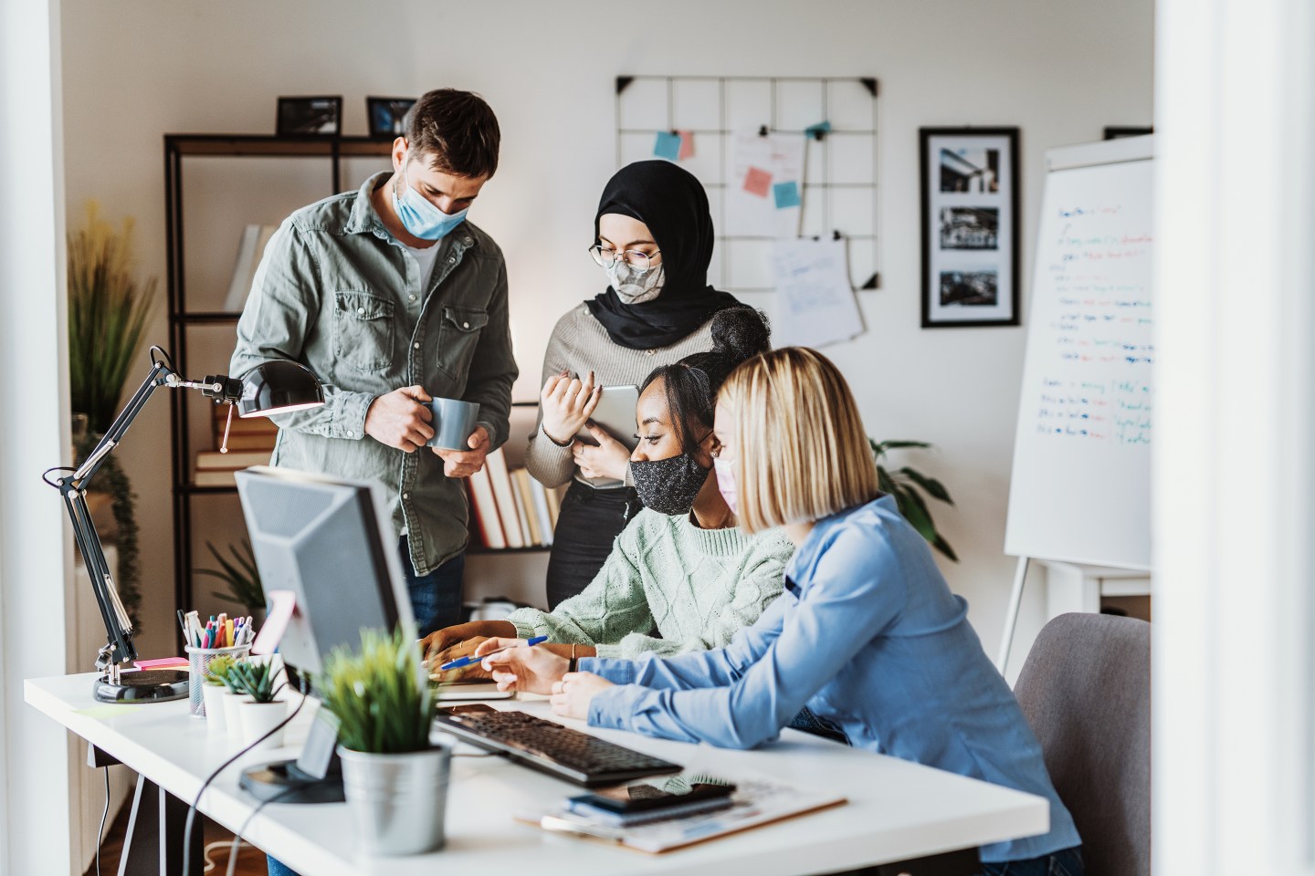 RaceAhead-Masked Employees In Office