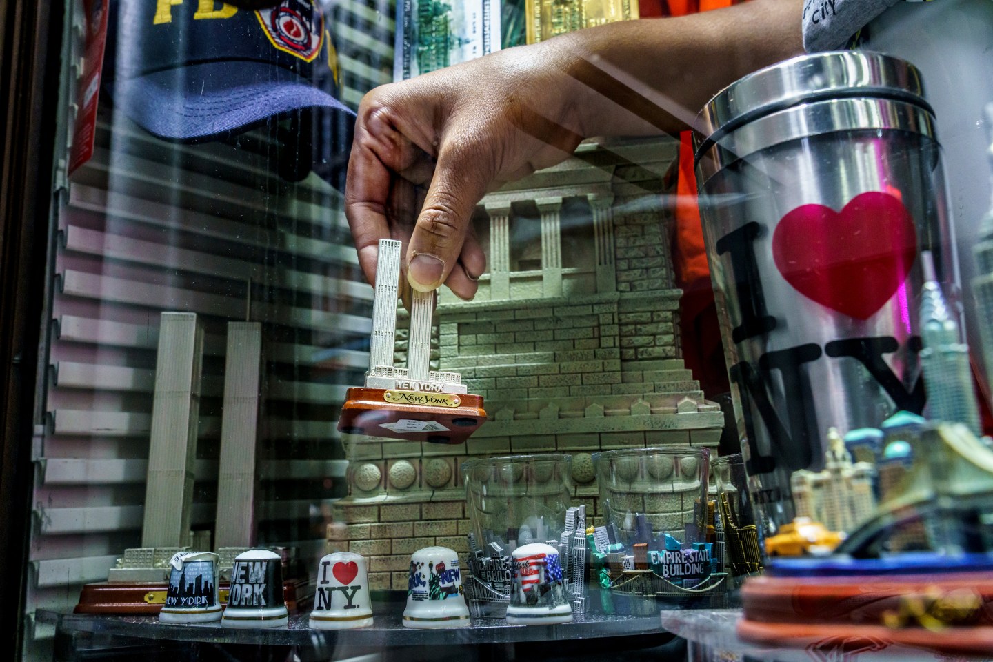 A model of the Twin Towers viewed through the window of a Financial District souvenir shop.