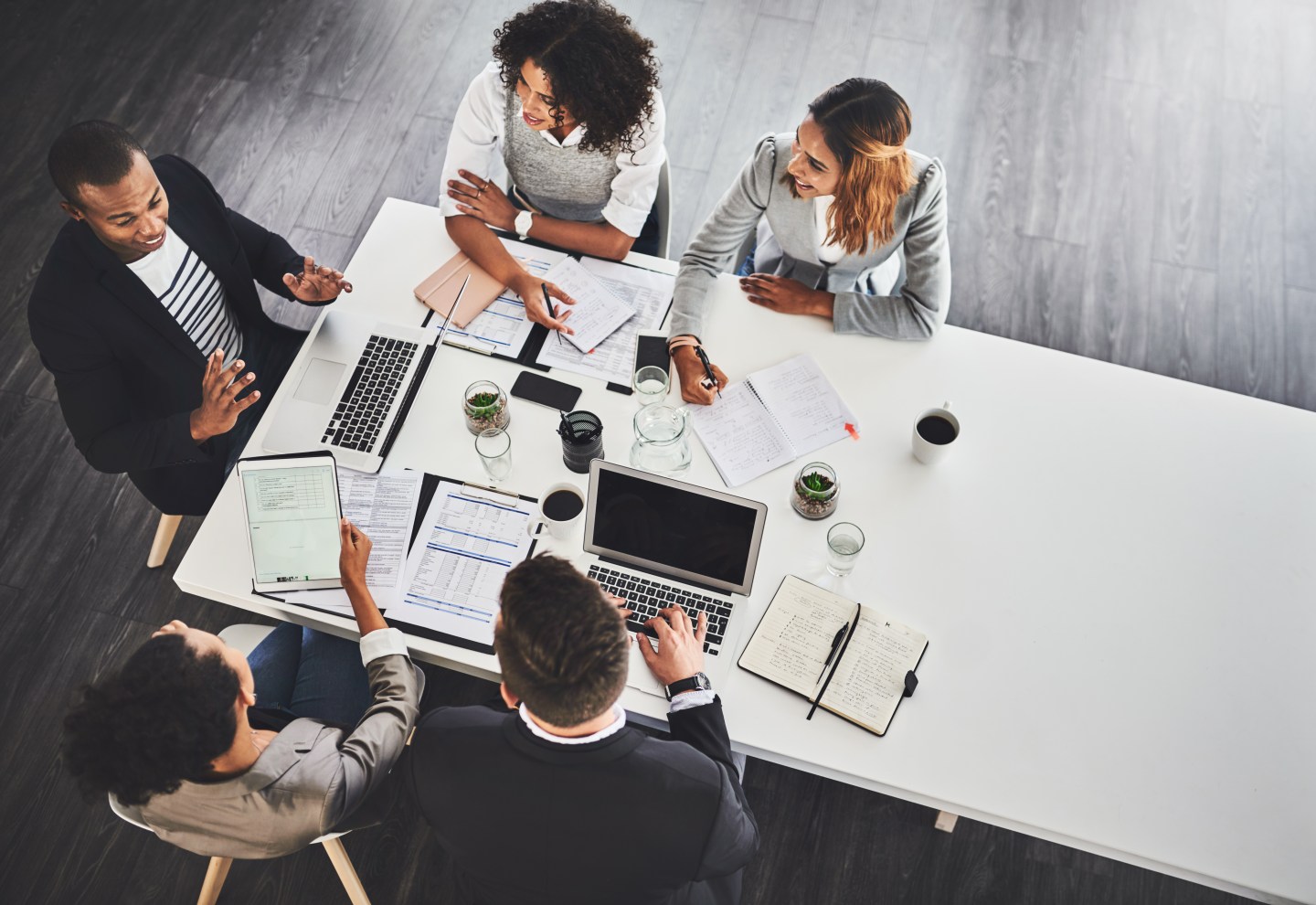 High angle shot of a group of businesspeople having a meeting in an office