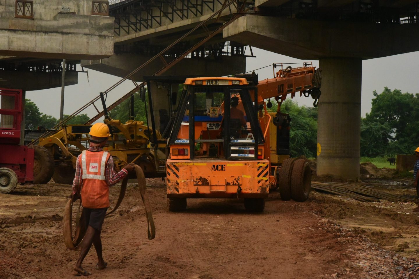 Construction workers at the northern state of Haryana's Sohna, on the outskirts of the national capital Delhi, building the Expressway that will connect at the other end to Mumbai, India's financial capital. The eight-lane Expressway will be the world's longest and expected to serve as a model for other highways being built in India.