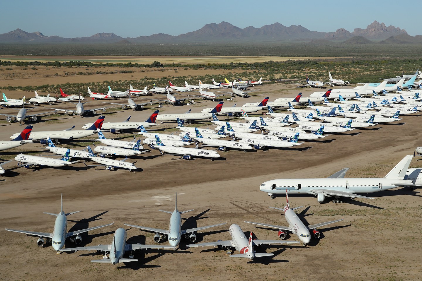 MARANA, ARIZONA &#8211; MAY 16: Decommissioned and suspended commercial aircrafts are seen stored in Pinal Airpark on May 16, 2020 in Marana, Arizona.  Pinal Airpark is the largest commercial aircraft storage facility in the world, currently holding increased numbers of aircraft in response to the coronavirus COVID-19 pandemic.   (Photo by Christian Petersen/Getty Images)