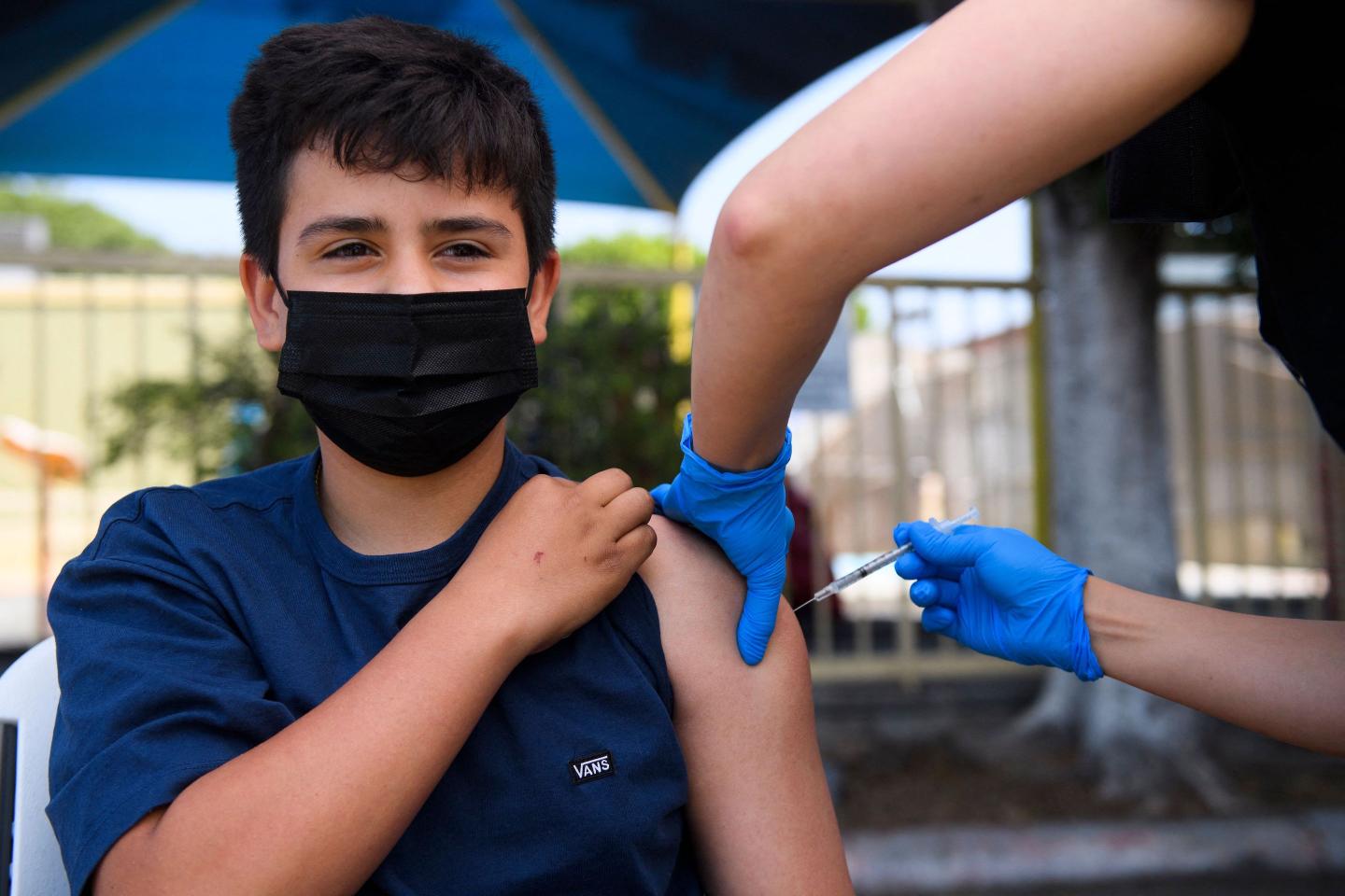 Pfizer says lower-dose COVID vaccine for younger kids also work for teens