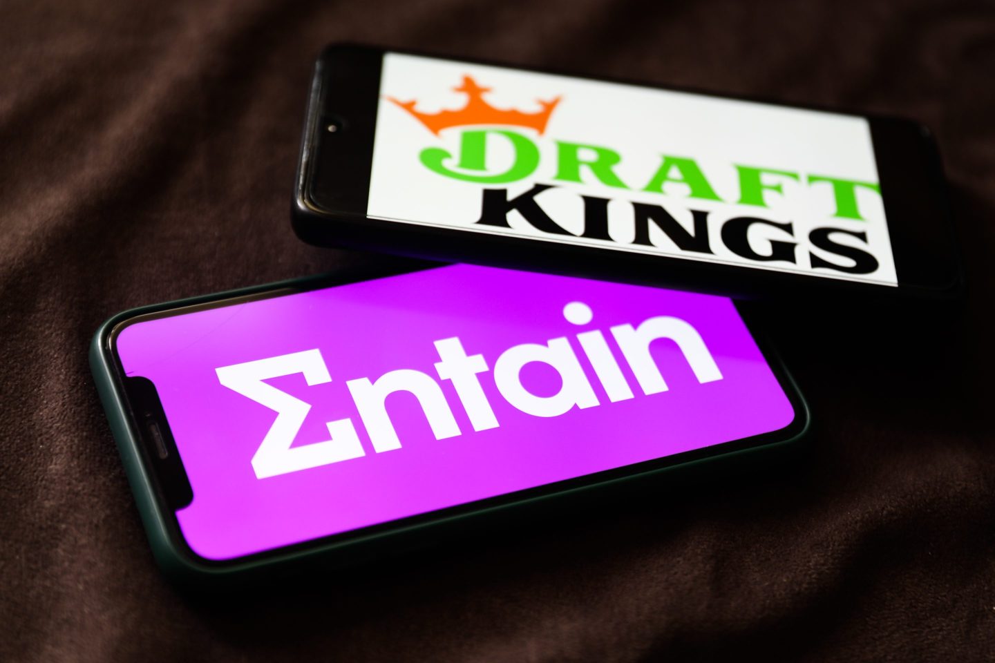 DraftKings and Entain logos
