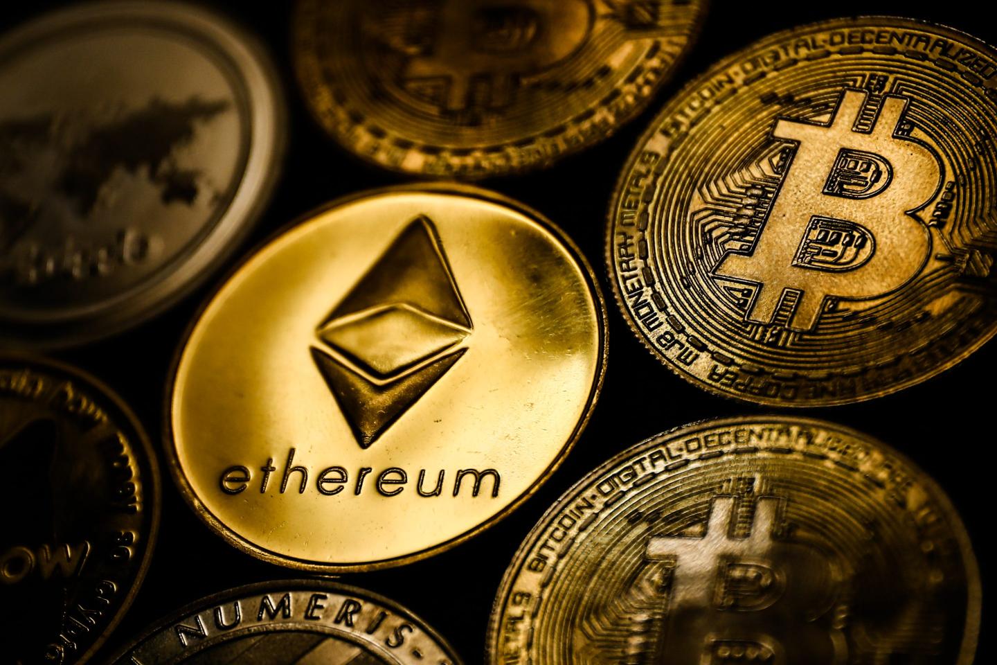 Bitcoin and other cryptocurrencies depicted as actual gold coins
