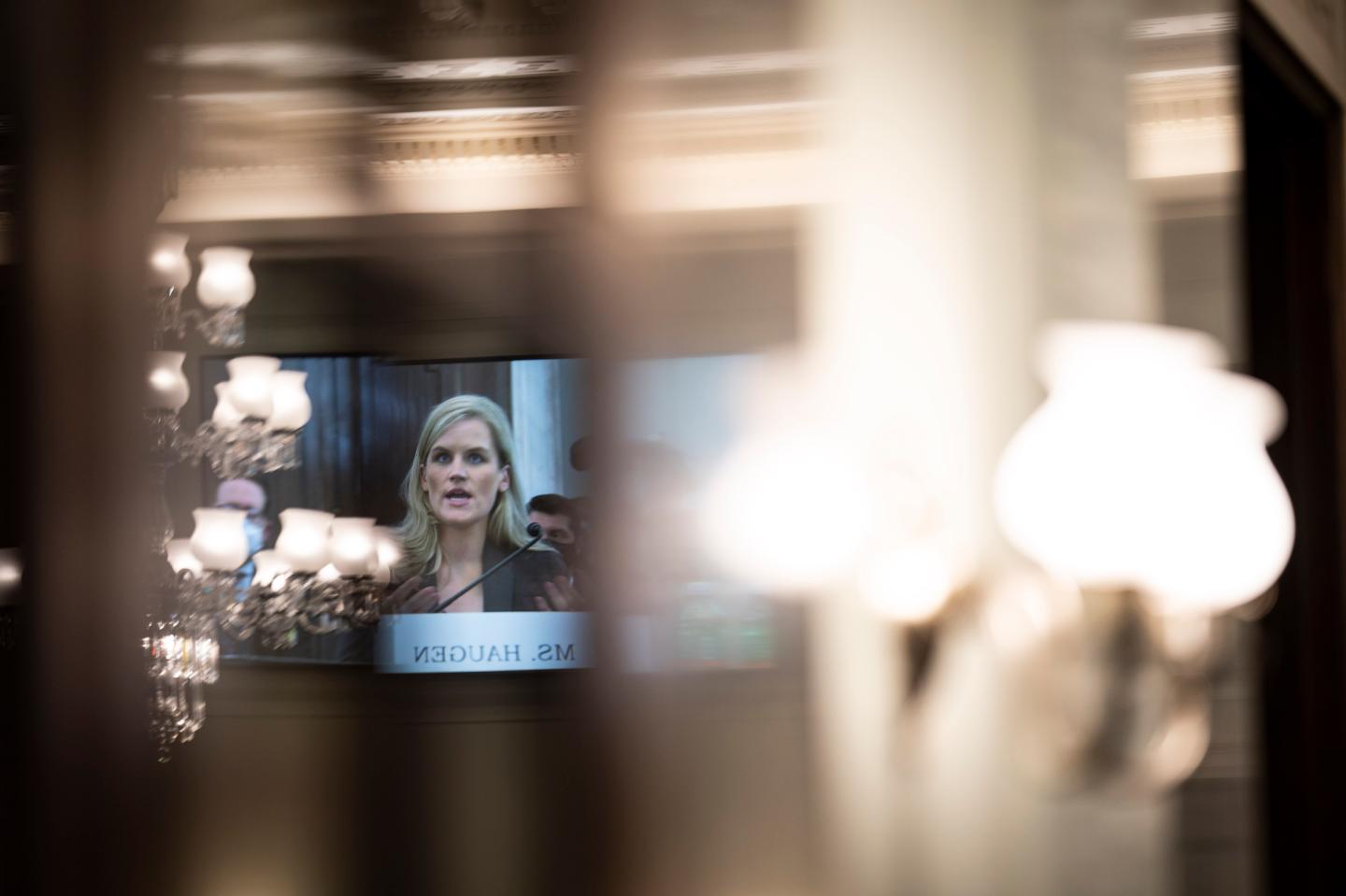 Former Facebook employee and whistleblower Frances Haugen, seen reflected in a screen, testifies during a Senate Committee on Commerce, Science, and Transportation hearing entitled 'Protecting Kids Online: Testimony from a Facebook Whistleblower' on Capitol Hill, October 05, 2021 in Washington, DC.