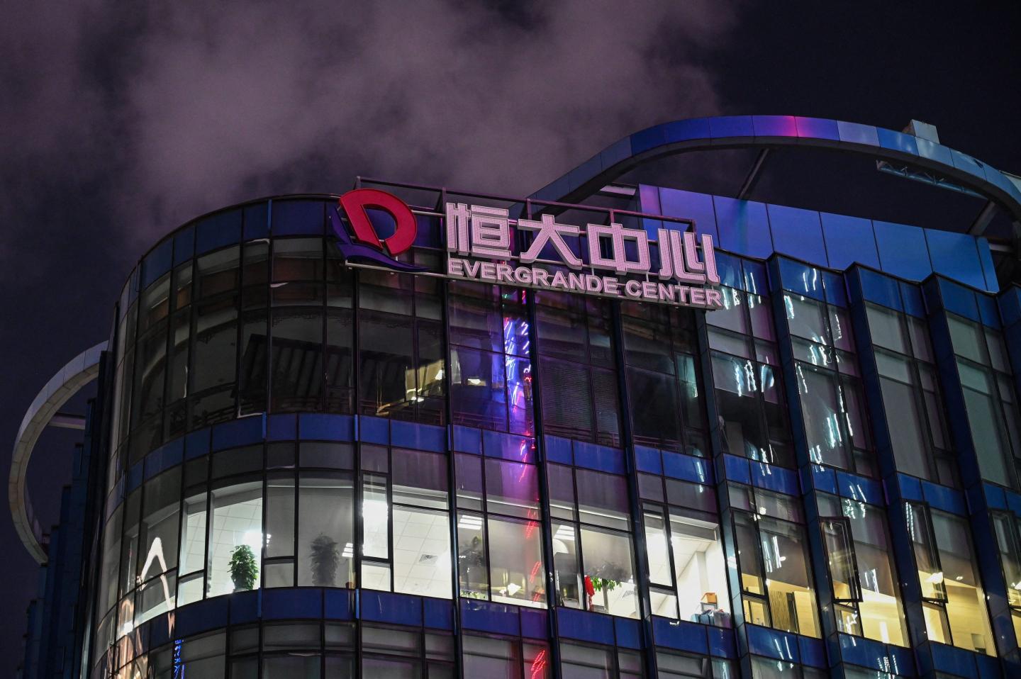 Evergrande avoids default by making a bond payment right before its make-or-break weekend deadline