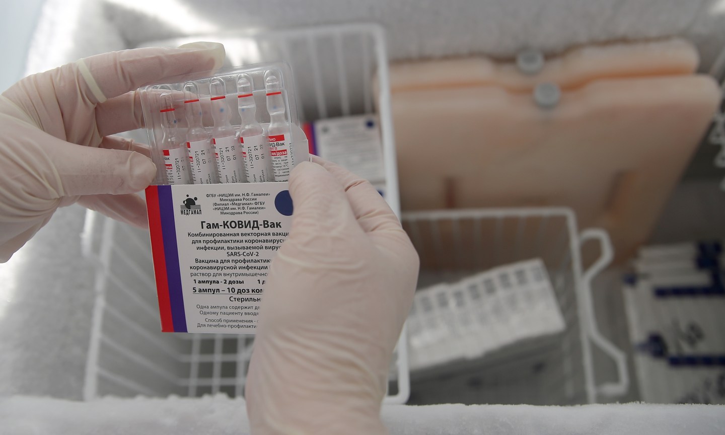 KAZAN, RUSSIA OCTOBER 11, 2021: A nurse opens a box of vials containing Component 2 of the Gam-COVID-Vac vaccine (under the brand name of Sputnik V) at a temporary vaccination site outside the Mega shopping centre.