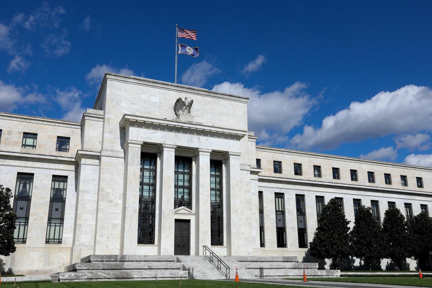 Federal Reserve bans officials from buying stocks and bonds, as well as restrict trading after ethics scandal