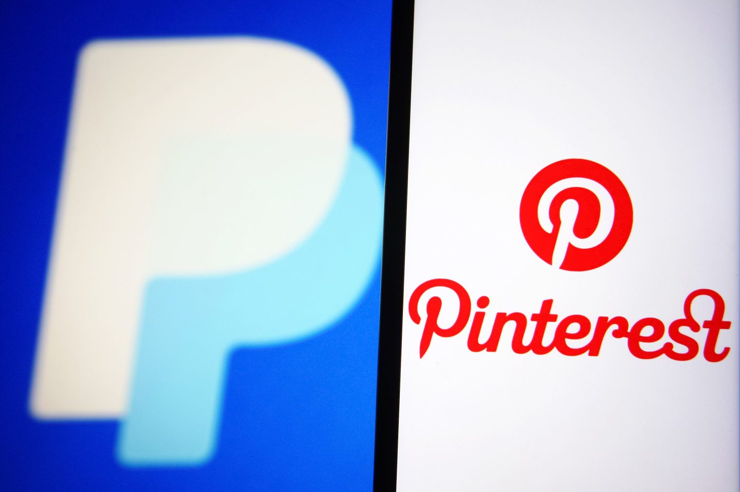 In this photo illustration a Pinterest logo of an image