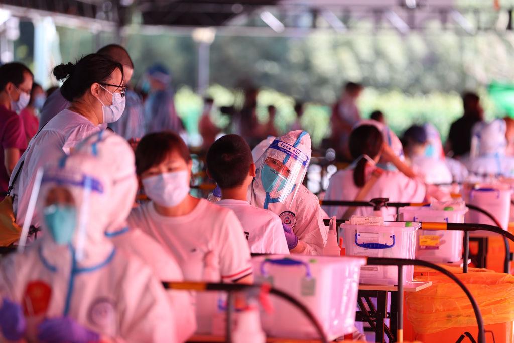China, one of the world’s few ‘COVID-zero’ holdouts, sets a loose timeline for easing virus measures