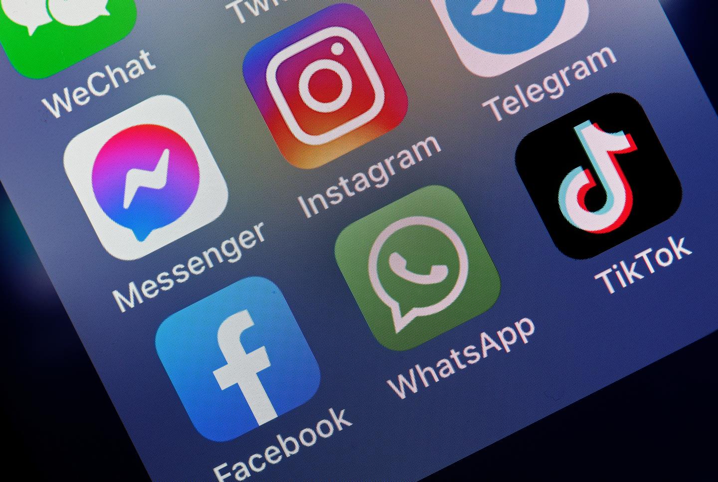 In this photo illustration, the logos of social media applications, Messenger, Instagram, Facebook, WhatsApp and TikTok is displayed on the screen of an iPhone on October 06, 2021 in Paris, France.