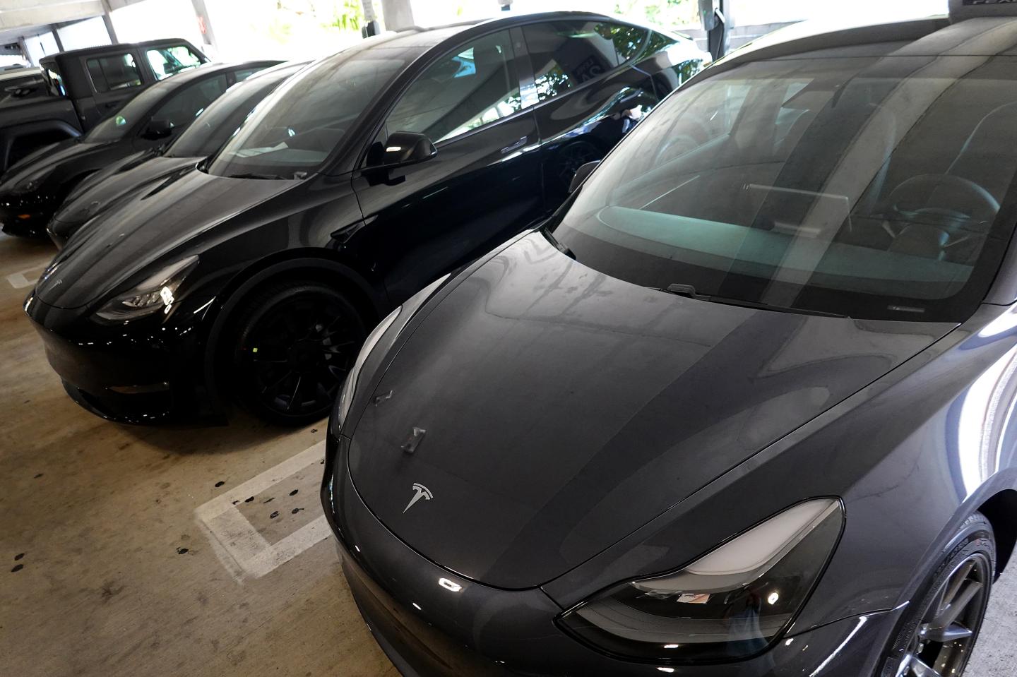 Tesla shares reach new heights as earnings supercharge rally