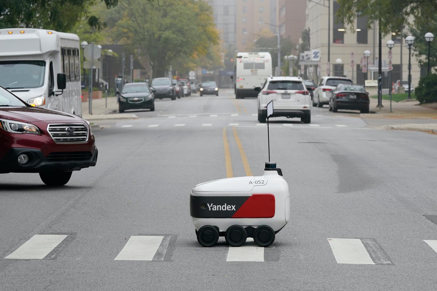 Robots roam some campuses and city streets as contactless food delivery grows