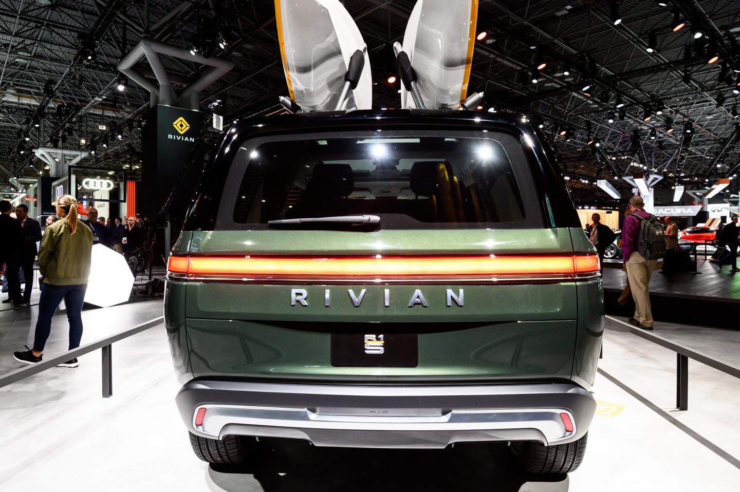 A former executive is suing electric vehicle maker Rivian, alleging gender discrimination.