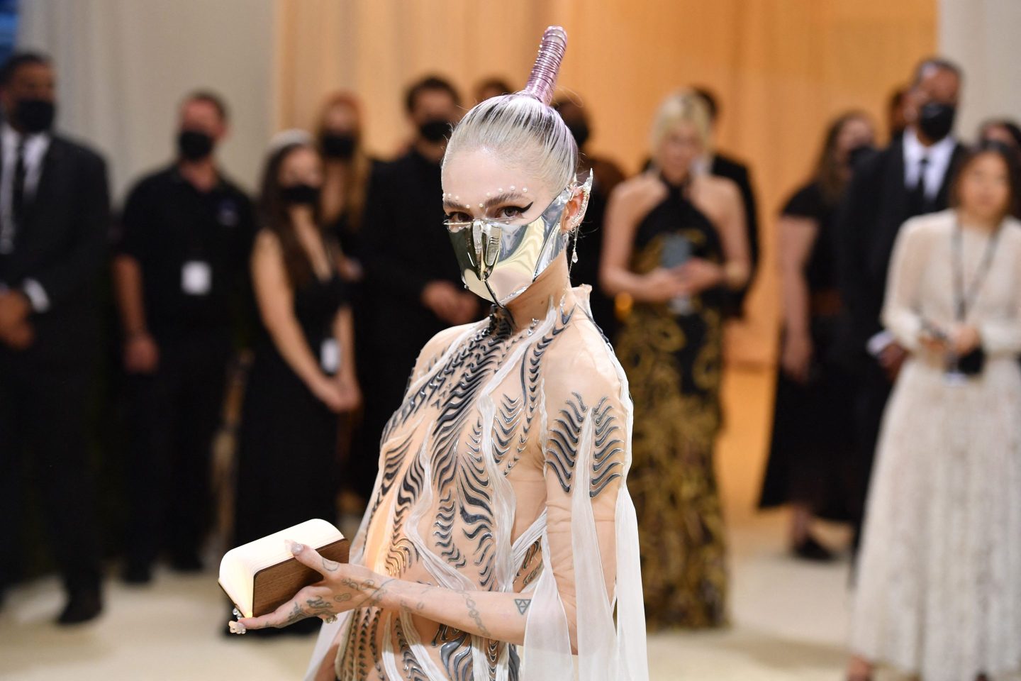 Canadian musician Grimes arrives for the 2021 Met Gala at the Metropolitan Museum of Art on September 13, 2021 in New York. &#8211; This year&#8217;s Met Gala has a distinctively youthful imprint, hosted by singer Billie Eilish, actor Timothee Chalamet, poet Amanda Gorman and tennis star Naomi Osaka, none of them older than 25. The 2021 theme is &#8220;In America: A Lexicon of Fashion.&#8221; (Photo by Angela WEISS / AFP) (Photo by ANGELA WEISS/AFP via Getty Images)