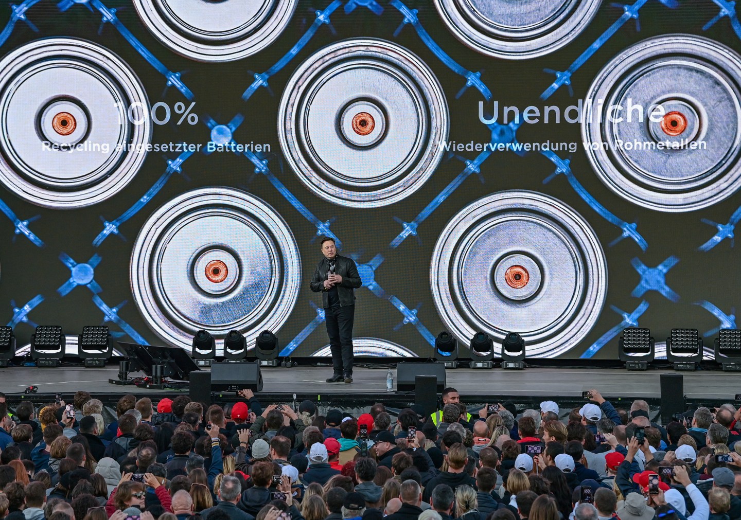 Elon Musk, Tesla CEO, stands on a stage at the Tesla Gigafactory on Oct. 9, 2021, in Grünheide, east of Berlin.