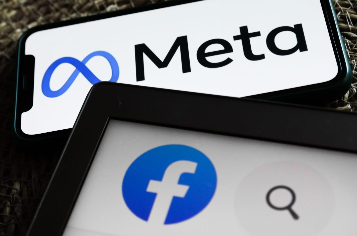 Meta and Facebook logos on phones