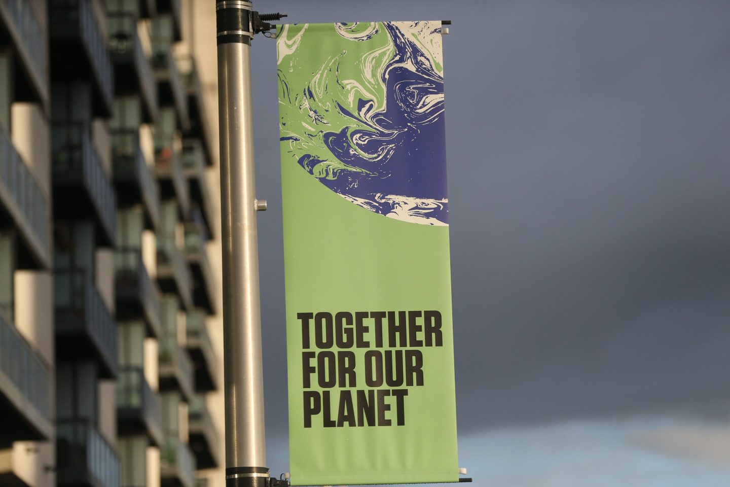 A street banner promoting COP26 in Glasgow. “I call on my colleagues, private sector leaders, and allied coalitions to be bold and step up—and proactively support the emergence of common, robust sustainability reporting standards,” writes Emmanuel Faber.