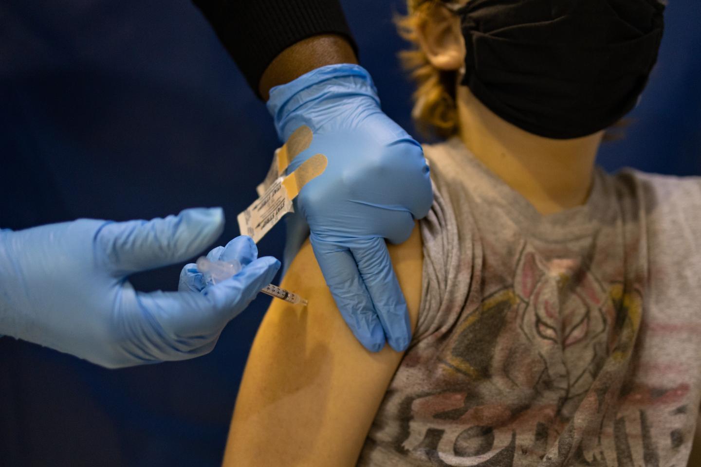 The most common COVID vaccine side effects in kids under 12—and how long they last