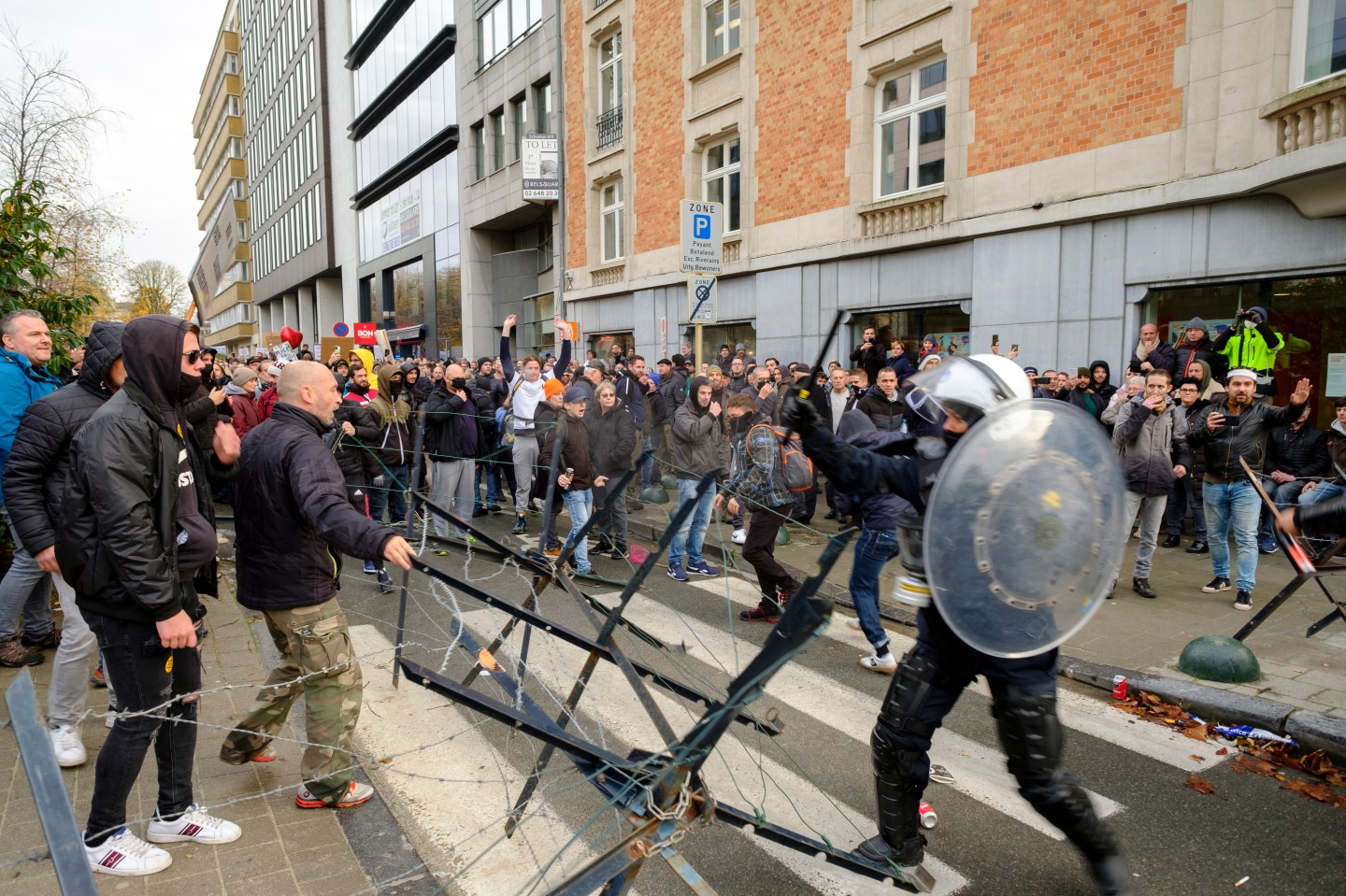 Protesters clash with police in front of the Gare du Nord for the demonstration entitled "Together for freedom" on November 21, 2021 in Brussels, Belgium.