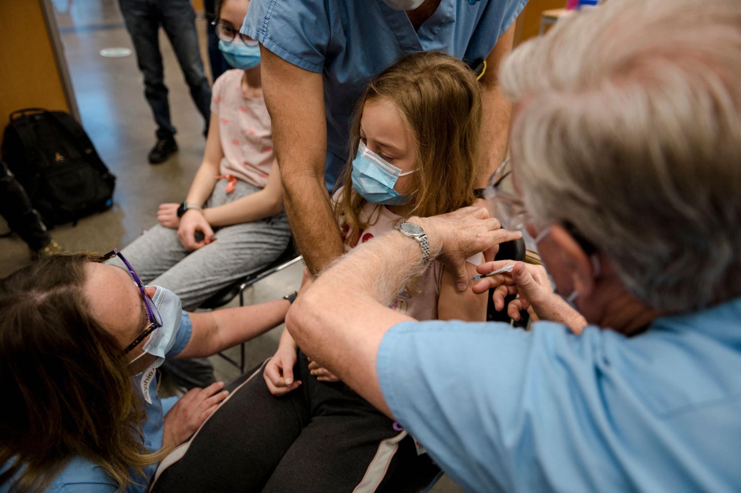 The two-shot regimen for younger kids is one-third the dose that’s given to people ages 12 and older.