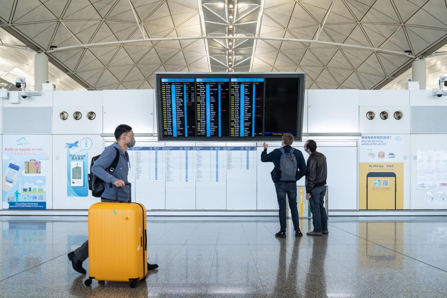 Holiday travel plans are in limbo as a growing list of countries introduce bans designed to stop the Omicron variant