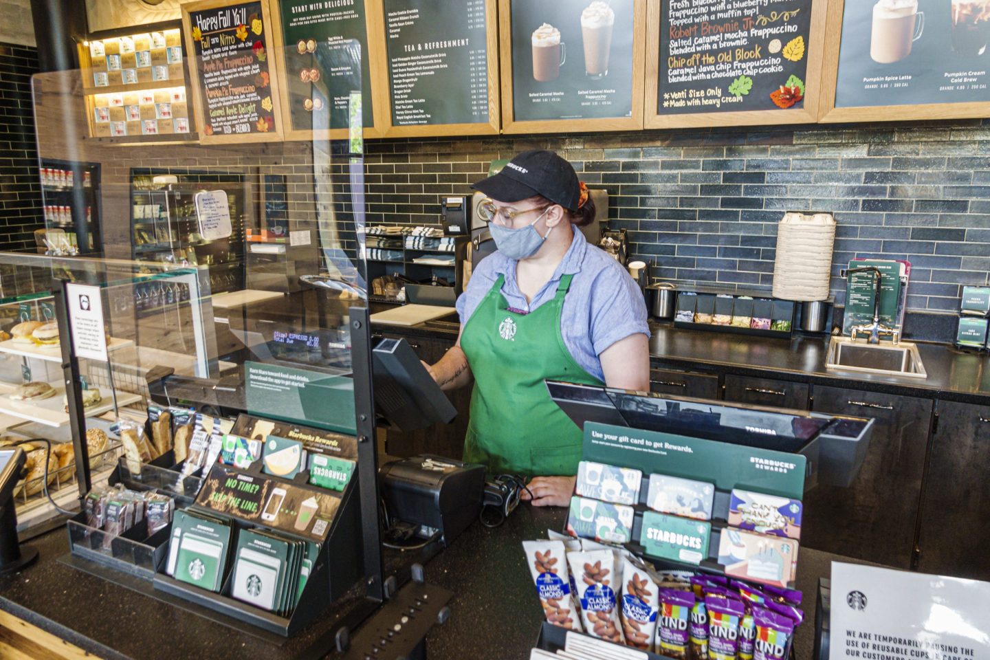 Starbucks barista behind at register