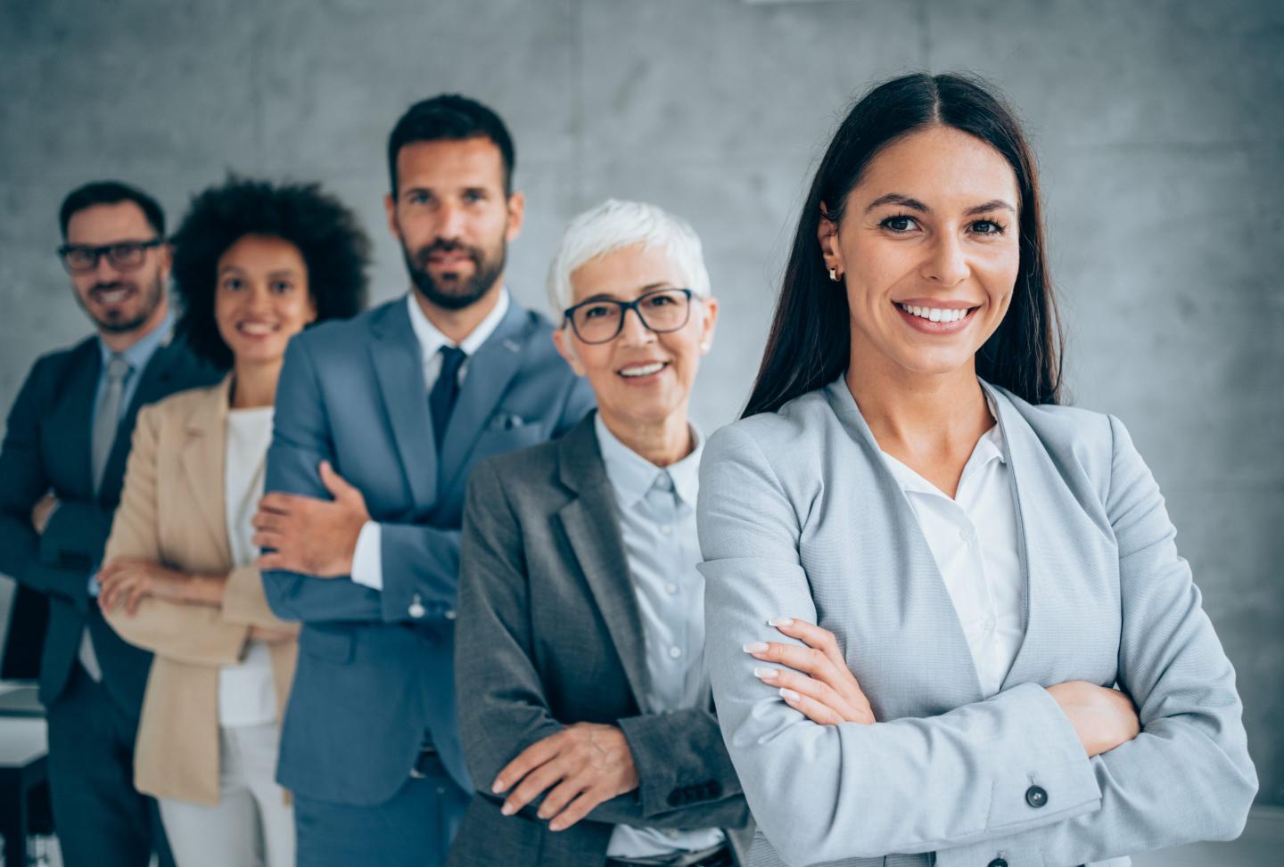 Confident businesswoman and her team.