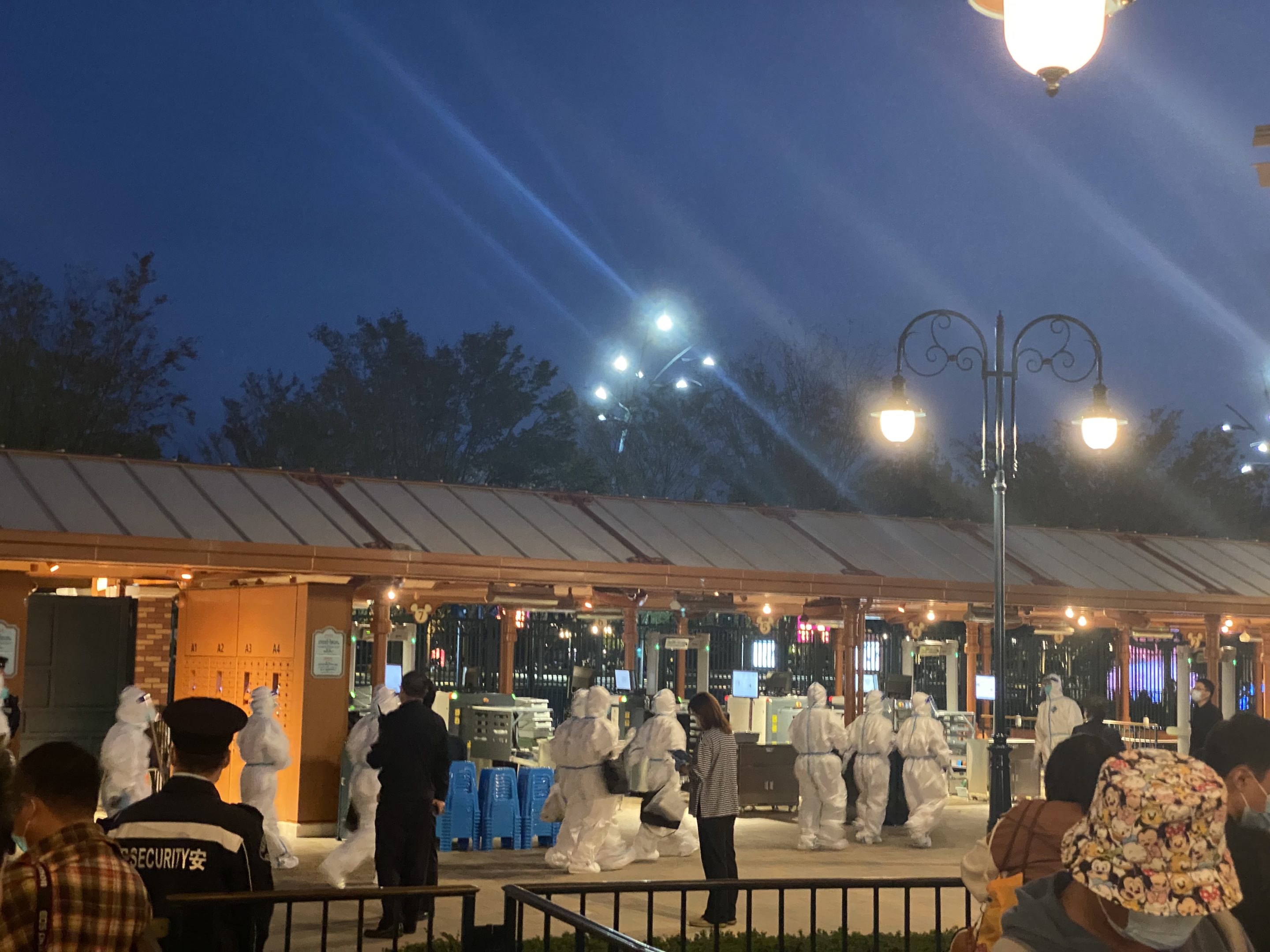 Tourists wait to receive a COVID-19 nucleic acid test at Shanghai Disney Resort on Oct. 31, 2021. The resort conducted on-site tests for over 33,000 people on Sunday night.