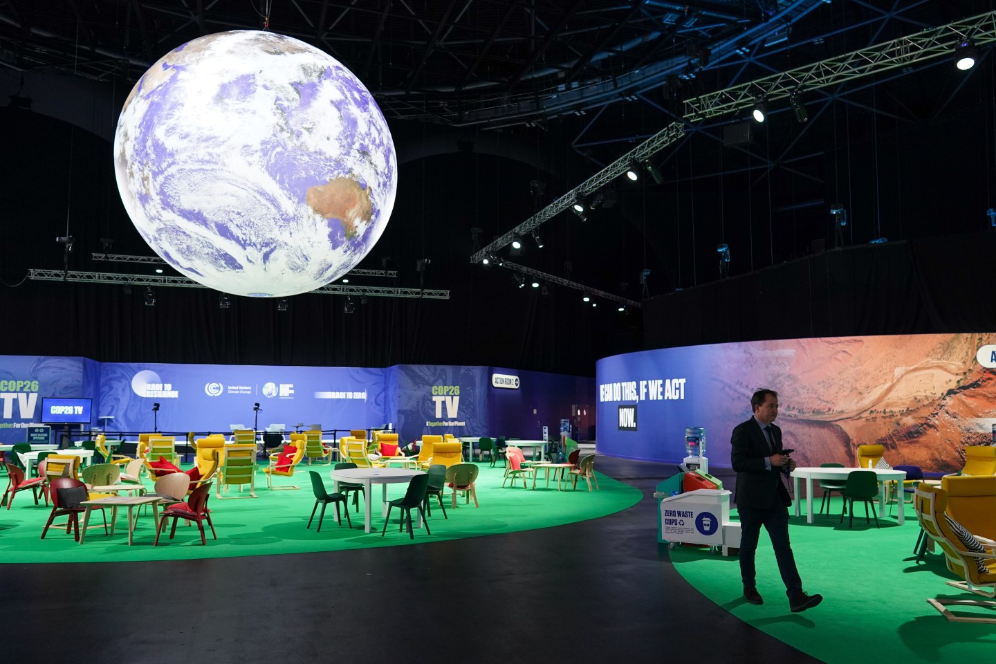 A man walks through the empty main room in the OVO Hydro building on day thirteen of the COP26 at SECC on November 12, 2021 in Glasgow, Scotland.