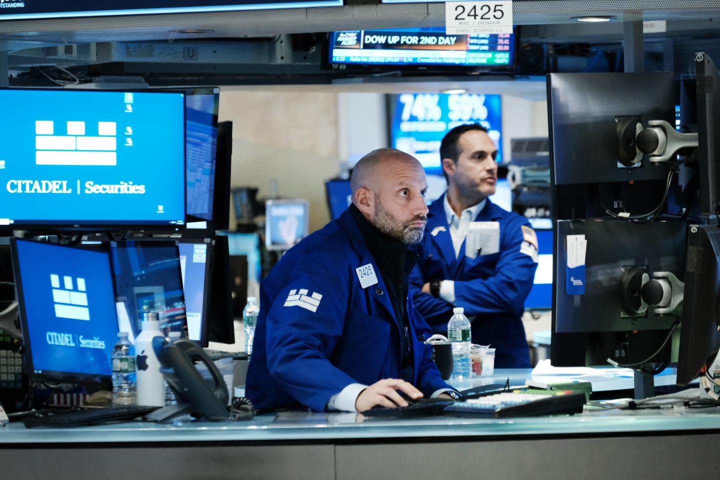 Traders work on the floor of the New York Stock Exchange