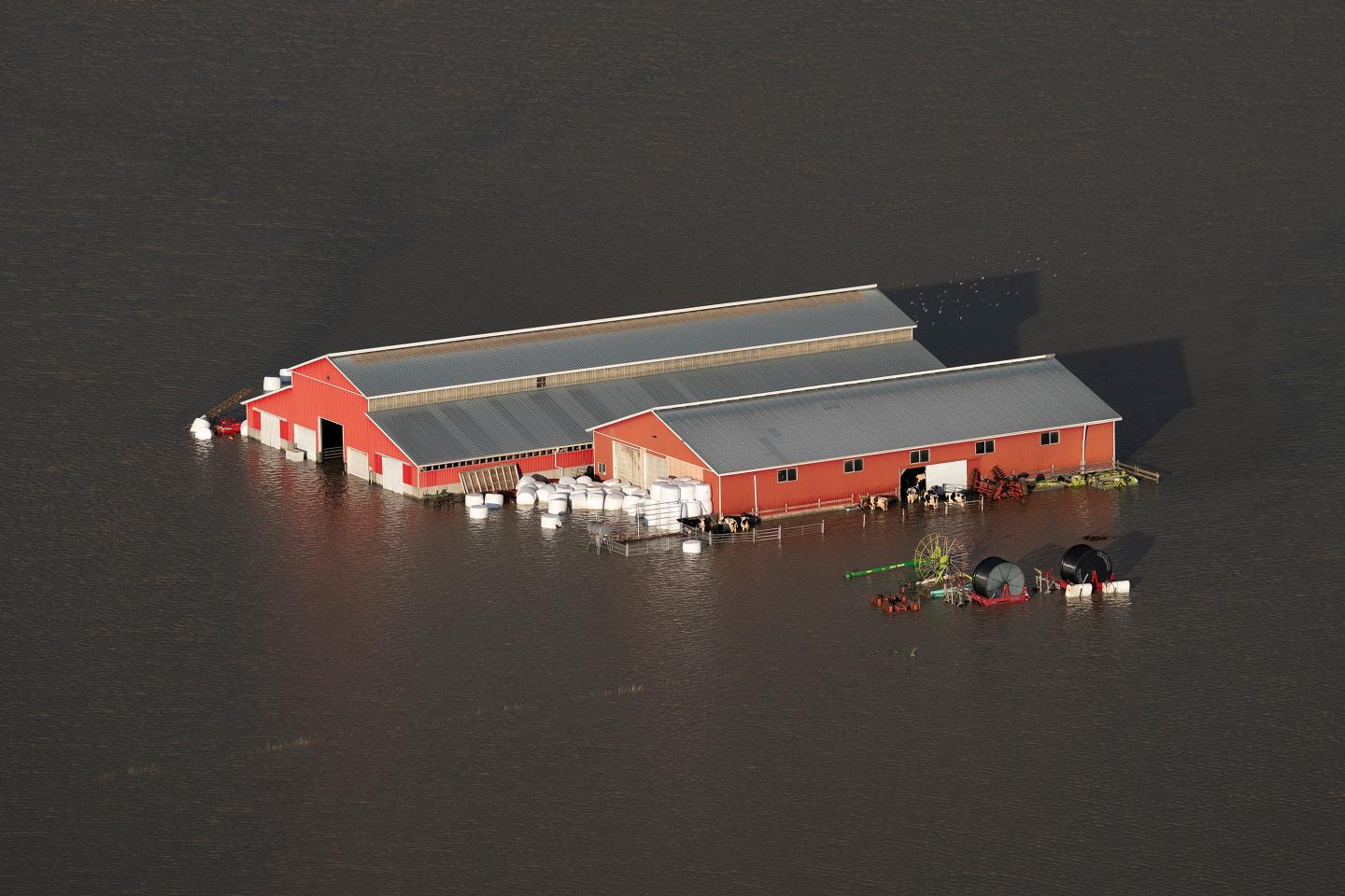 A barn is seen surrounded by flood waters in British Columbia.