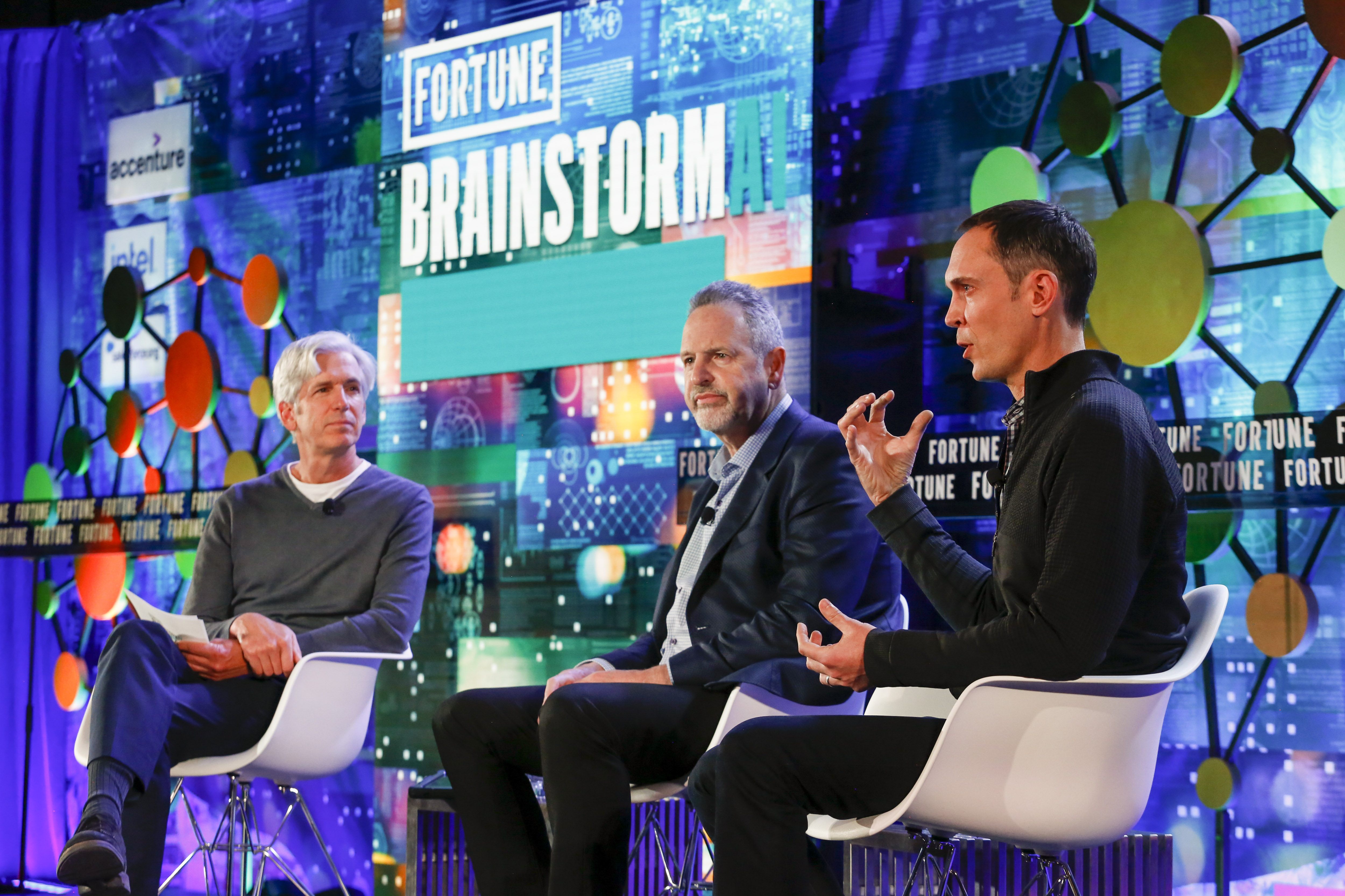 Fortune’s Verne Kopytoff moderates a panel with Rene Haas, then president of the IP products group at Arm, and Andy Hock, VP of product at Cerebras Systems, at Fortune Brainstorm A.I. in Boston, Nov. 8, 2021.