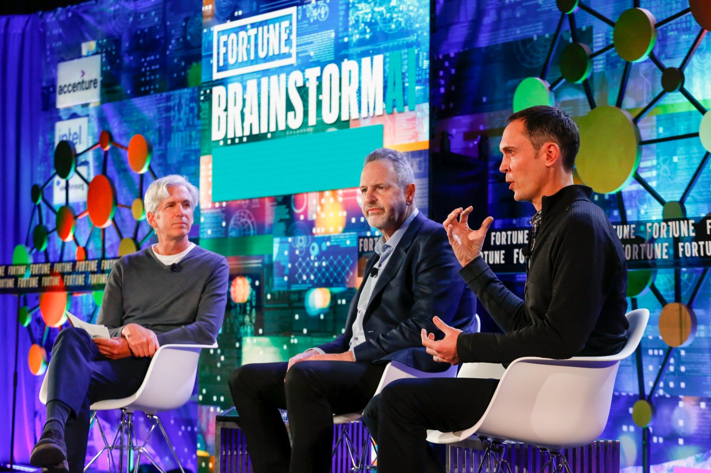 Fortune’s Verne Kopytoff moderates a panel with Rene Haas, then president of the IP products group at Arm, and Andy Hock, VP of product at Cerebras Systems, at Fortune Brainstorm A.I. in Boston, Nov. 8, 2021.
