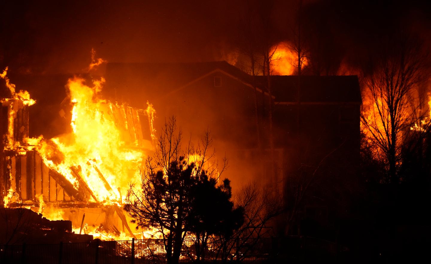 Tens of thousands evacuate as Colorado wildfires burn hundreds of homes