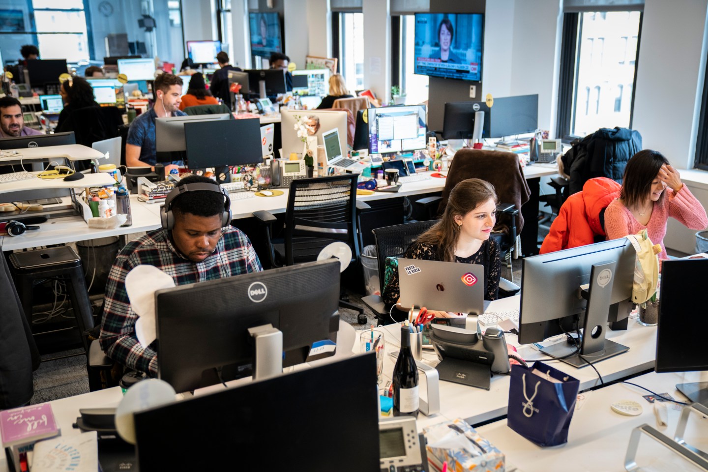 Members of BuzzFeed News working at their desks.