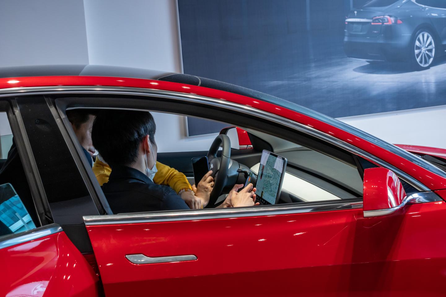 Highway-safety regulators open probe into Tesla’s controversial in-car video game feature