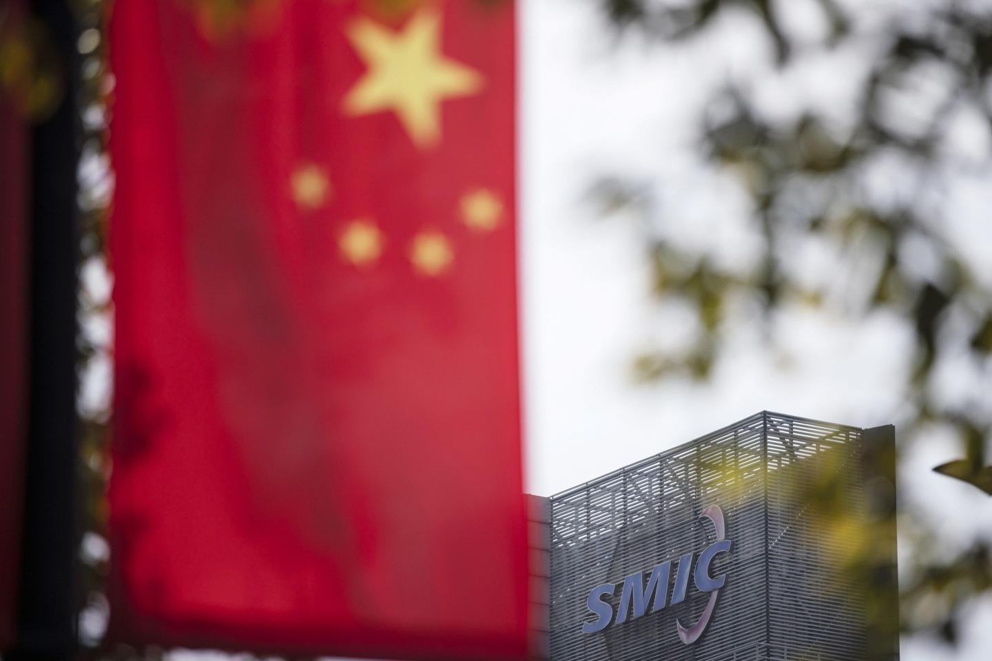 Shares of China’s largest chipmaker sink to lowest close in nearly a year as Biden team considers tougher sanctions