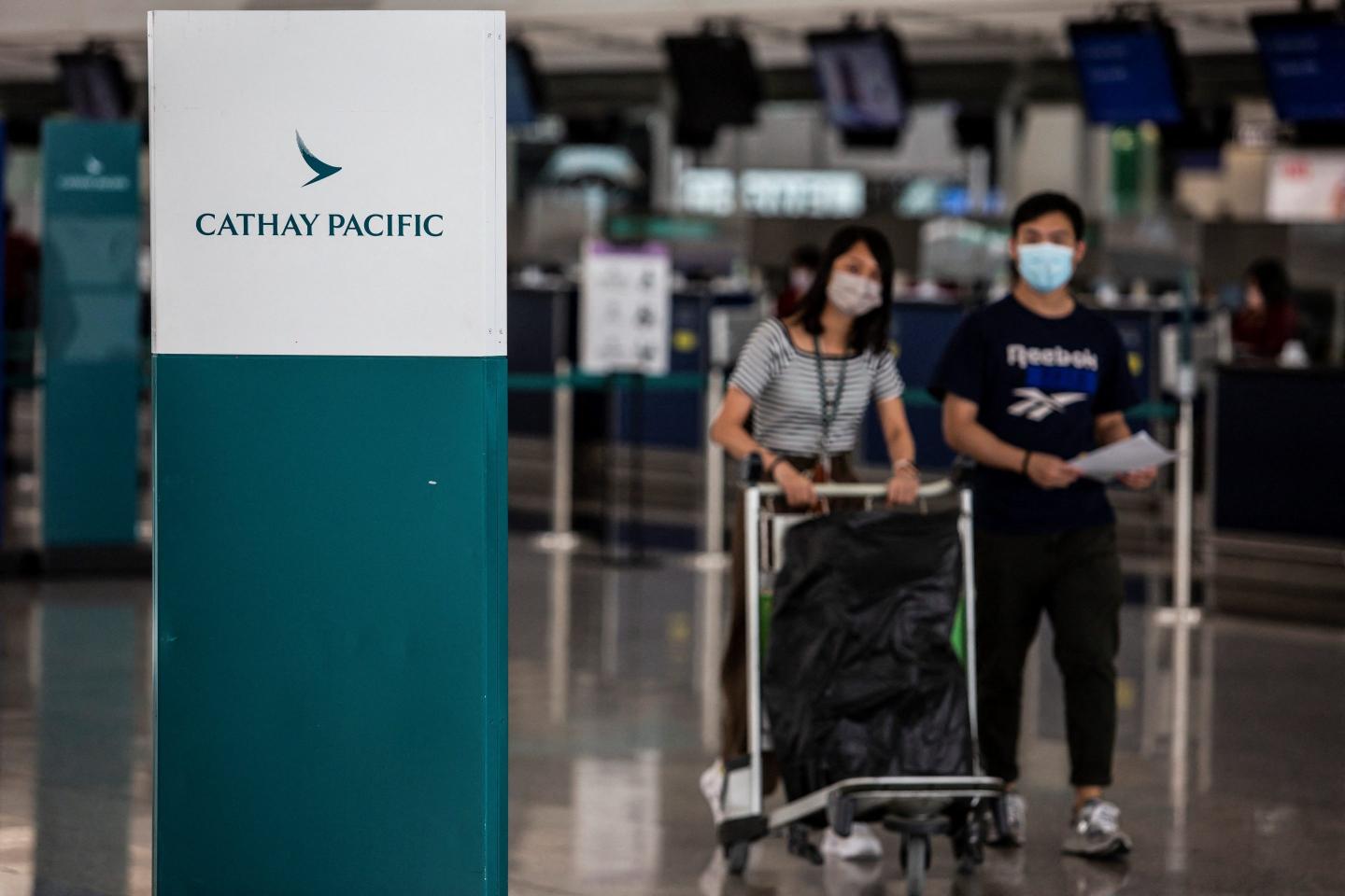 Travelers at Hong Kong International Airport.