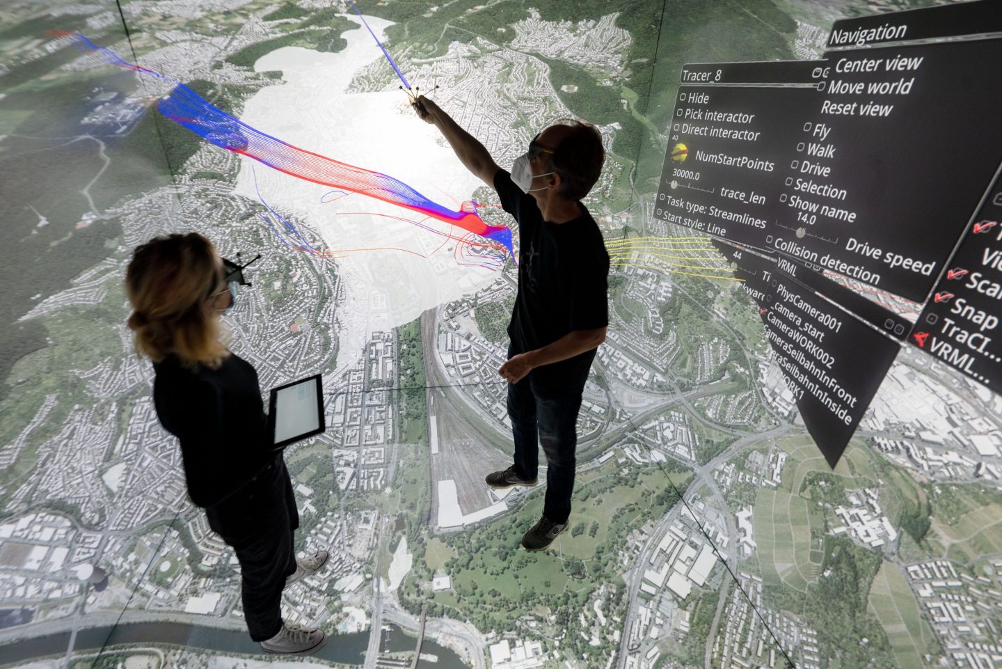 Two employees of the High Performance Computing Center Stuttgart demonstrate a "virtual environment" that tracks pollution in the Stuttgart city center. "Although the coming wave of digital data may be intimidating in its sheer size, high-performance computing can help businesses harness its power and ride it to new heights," writes Kevin Zhang.