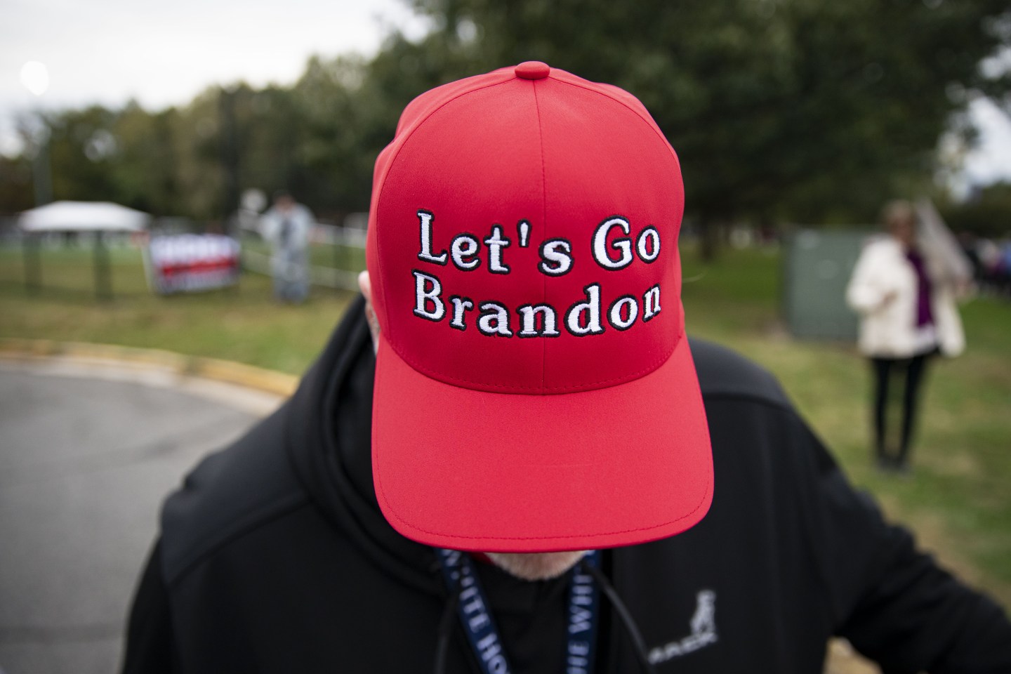 A man wearing a "Let's go Brandon" hat.