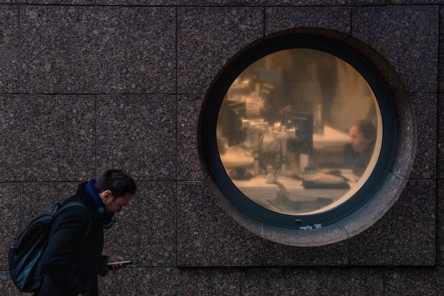 An office worker sits at his desk during the morning rush hour.