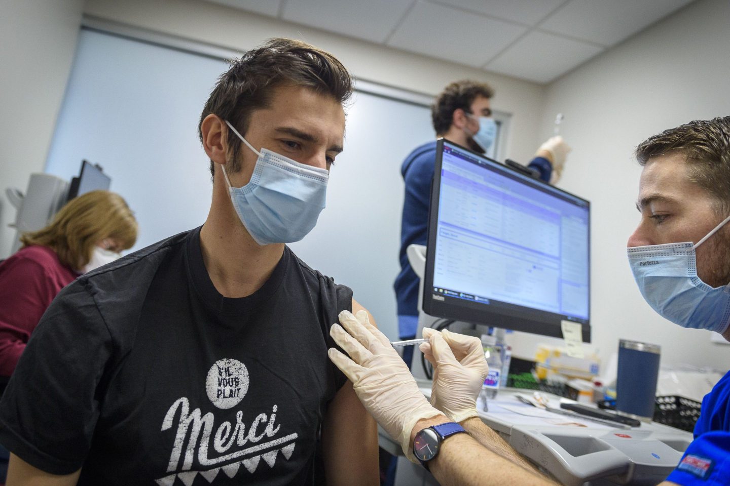 A man receives a vaccine shot