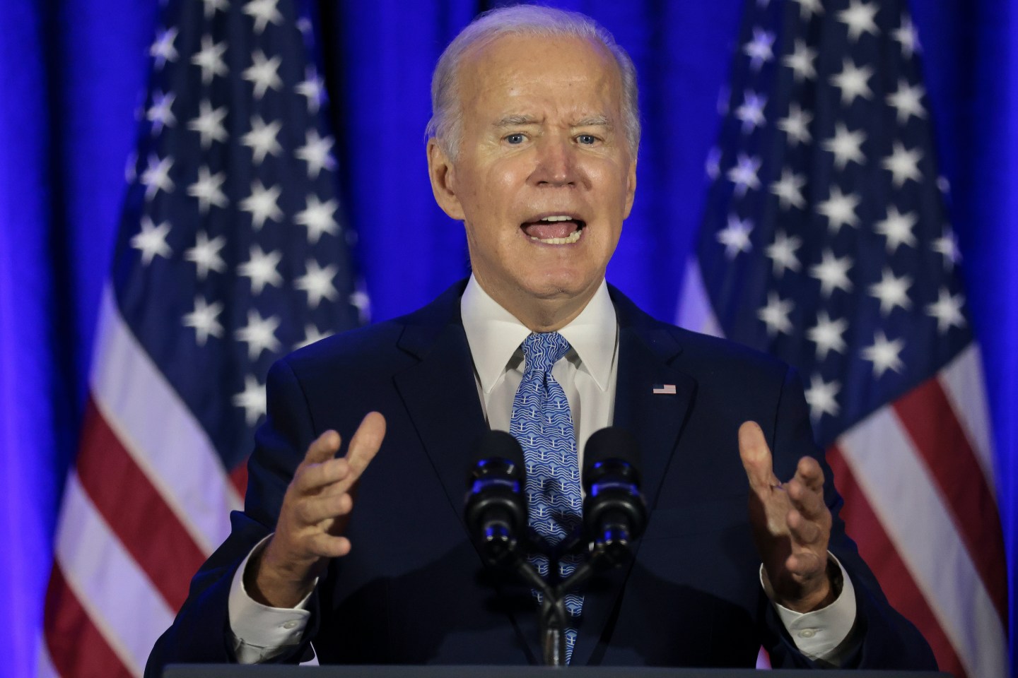 U.S. President Joe Biden speaks during the holiday celebration for the Democratic National Committee (DNC) at the Hotel Washington in Washington, D.C., U.S., on Tuesday, Dec. 14, 2021. The District of Columbia sued the Proud Boys and the Oath Keepers right-wing groups for allegedly conspiring to terrorize the U.S. Capitol on Jan. 6, when a mob of former president Trump&#8217;s supporters tried to stop the certification of Biden&#8217;s election victory. Photographer: Oliver Contreras/Sipa/Bloomberg