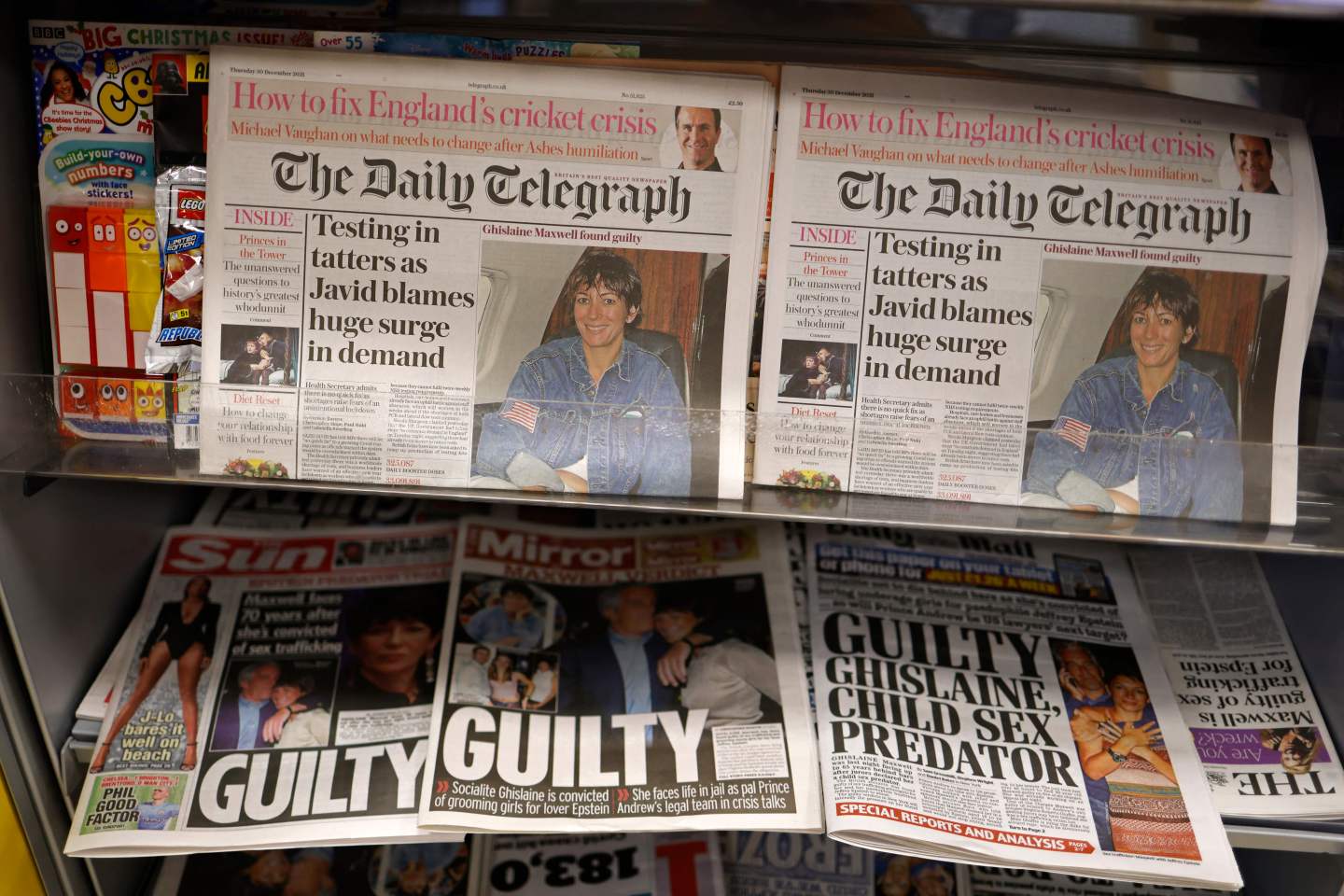 A selection of headlines from British newspapers is pictured in a store in London on December 30, 2021, the morning after a jury in New York found Ghislaine Maxwell guilty of recruiting and grooming young girls to be sexually abused by the late American financier Jeffrey Epstein. &#8211; Maxwell, who turned 60 on Christmas Day, was convicted by a 12-person jury of five of the six counts she was facing including the most serious charge of sex trafficking a minor. (Photo by Tolga Akmen / AFP) (Photo by TOLGA AKMEN/AFP via Getty Images)